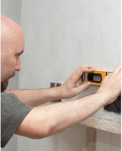 Electrician installing wall outlets 
