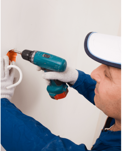Electrician installing wall outlets 